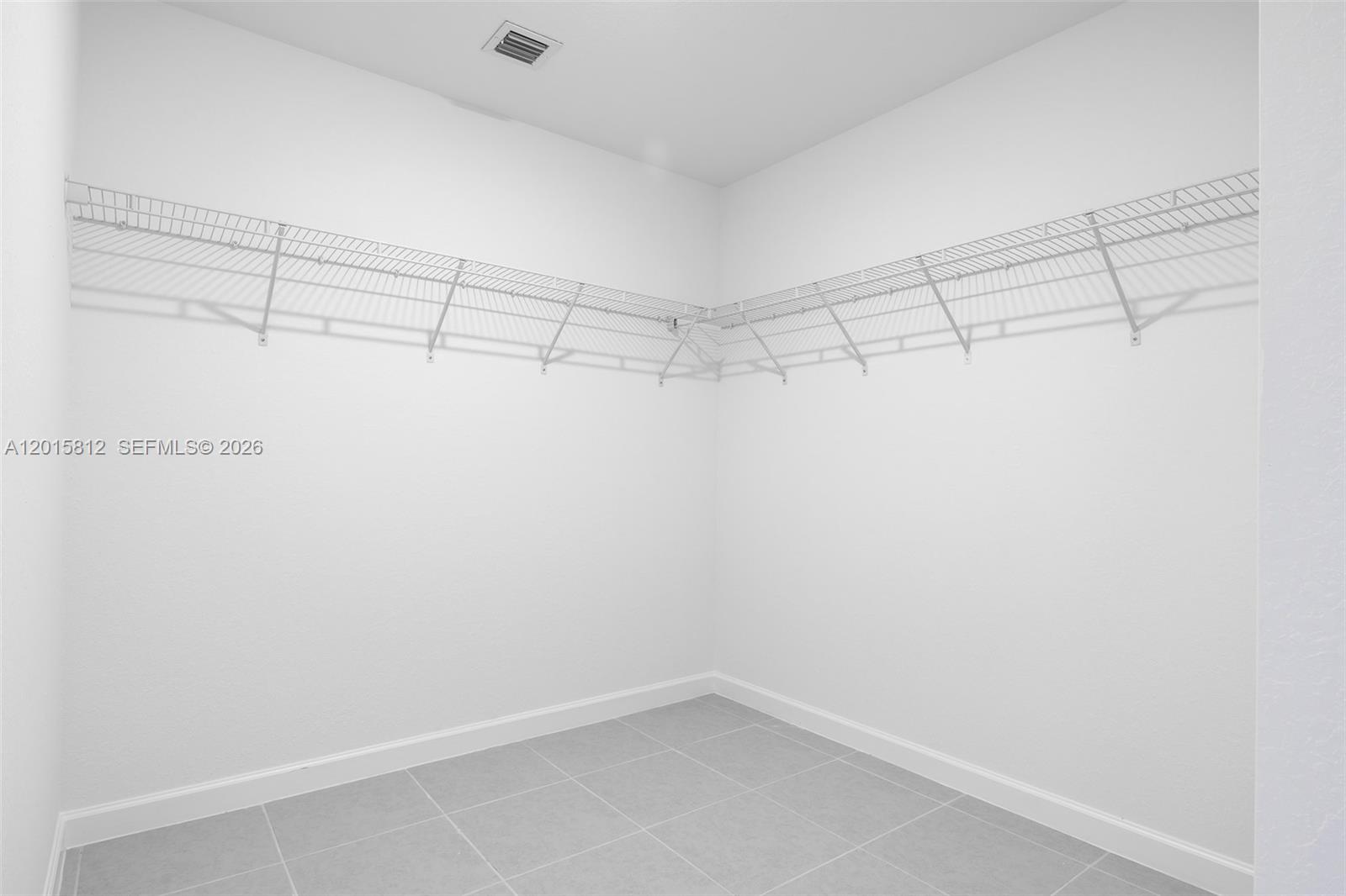 17564 Southwest 285th Street Homestead, FL 33030 - Photo 19 of 42 a view of a room with racks on the wall