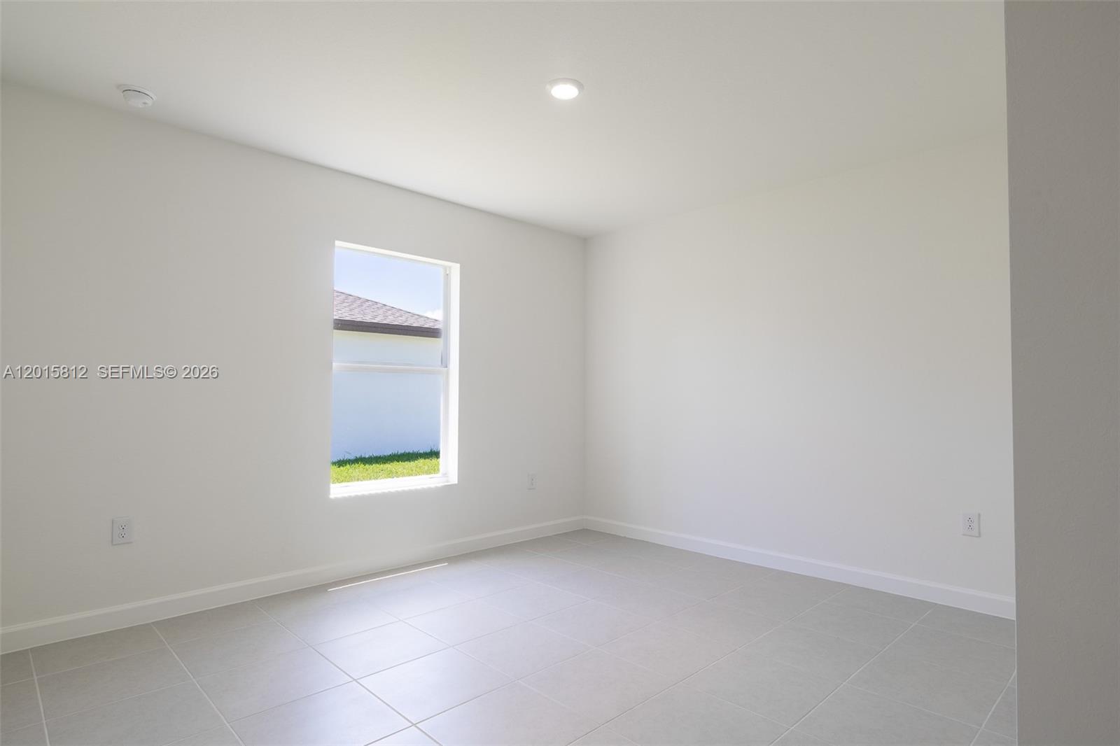 17564 Southwest 285th Street Homestead, FL 33030 - Photo 23 of 42 a view of an empty room with a window