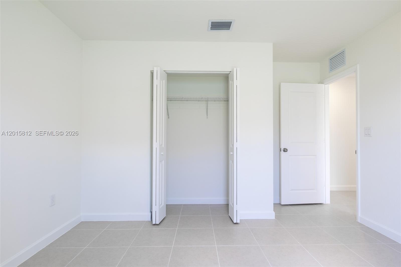 17564 Southwest 285th Street Homestead, FL 33030 - Photo 24 of 42 an empty room with closet