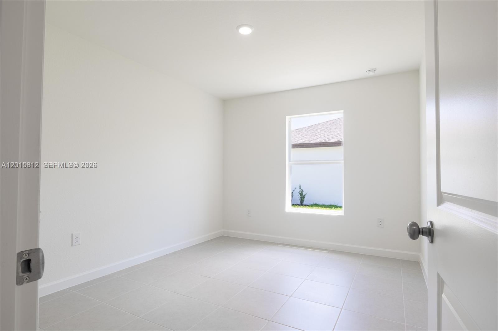 17564 Southwest 285th Street Homestead, FL 33030 - Photo 27 of 42 an empty room with a window