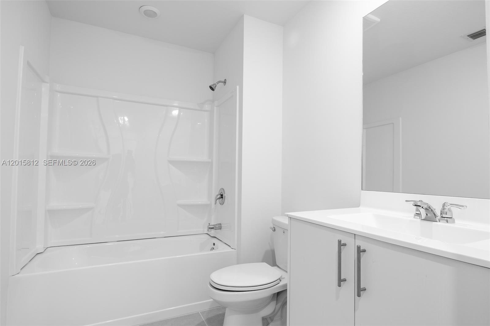 17564 Southwest 285th Street Homestead, FL 33030 - Photo 29 of 42 a bathroom with a granite countertop sink a toilet and shower