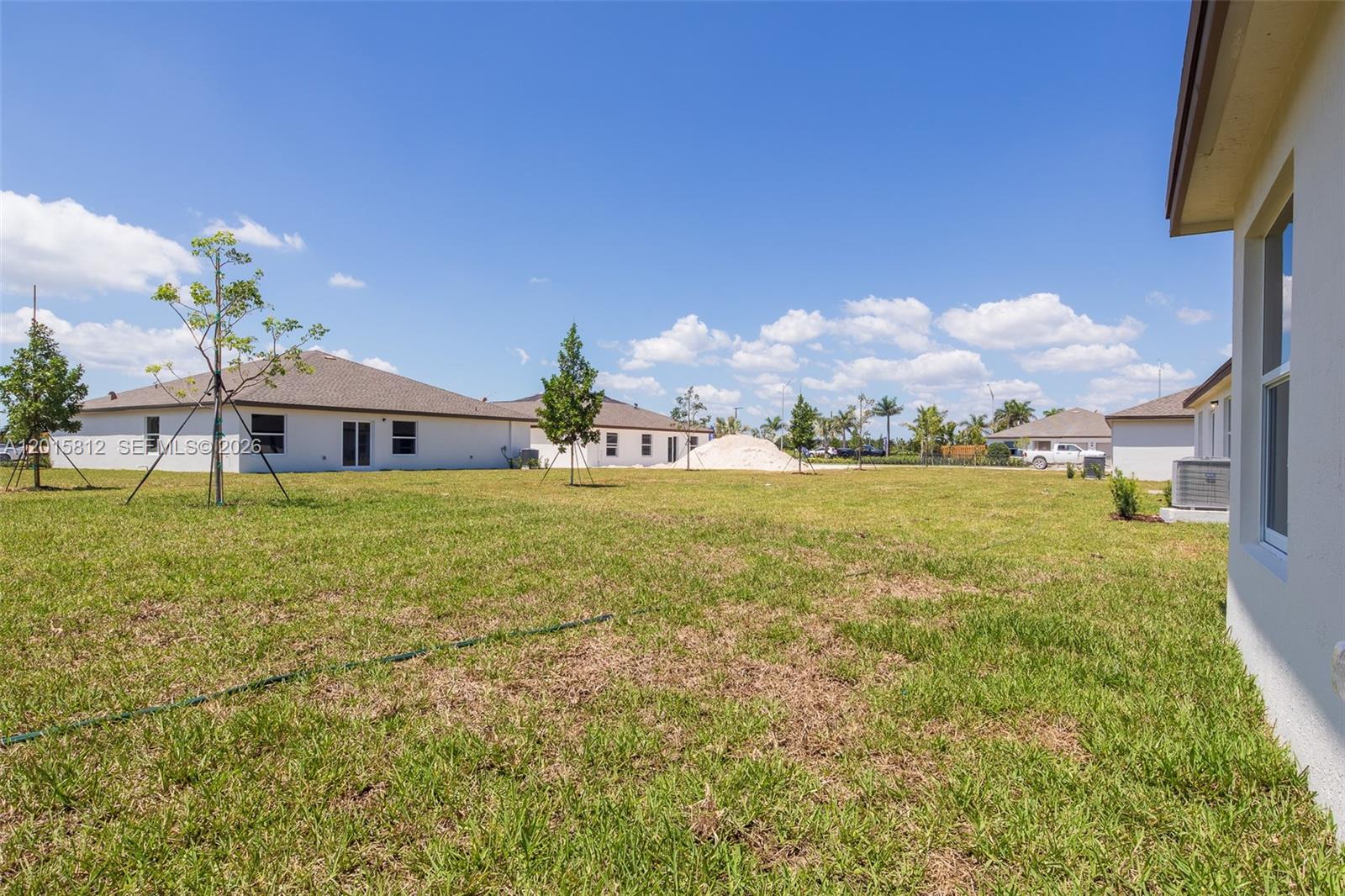 17564 Southwest 285th Street Homestead, FL 33030 - Photo 30 of 42 a front view of house with yard and ocean view