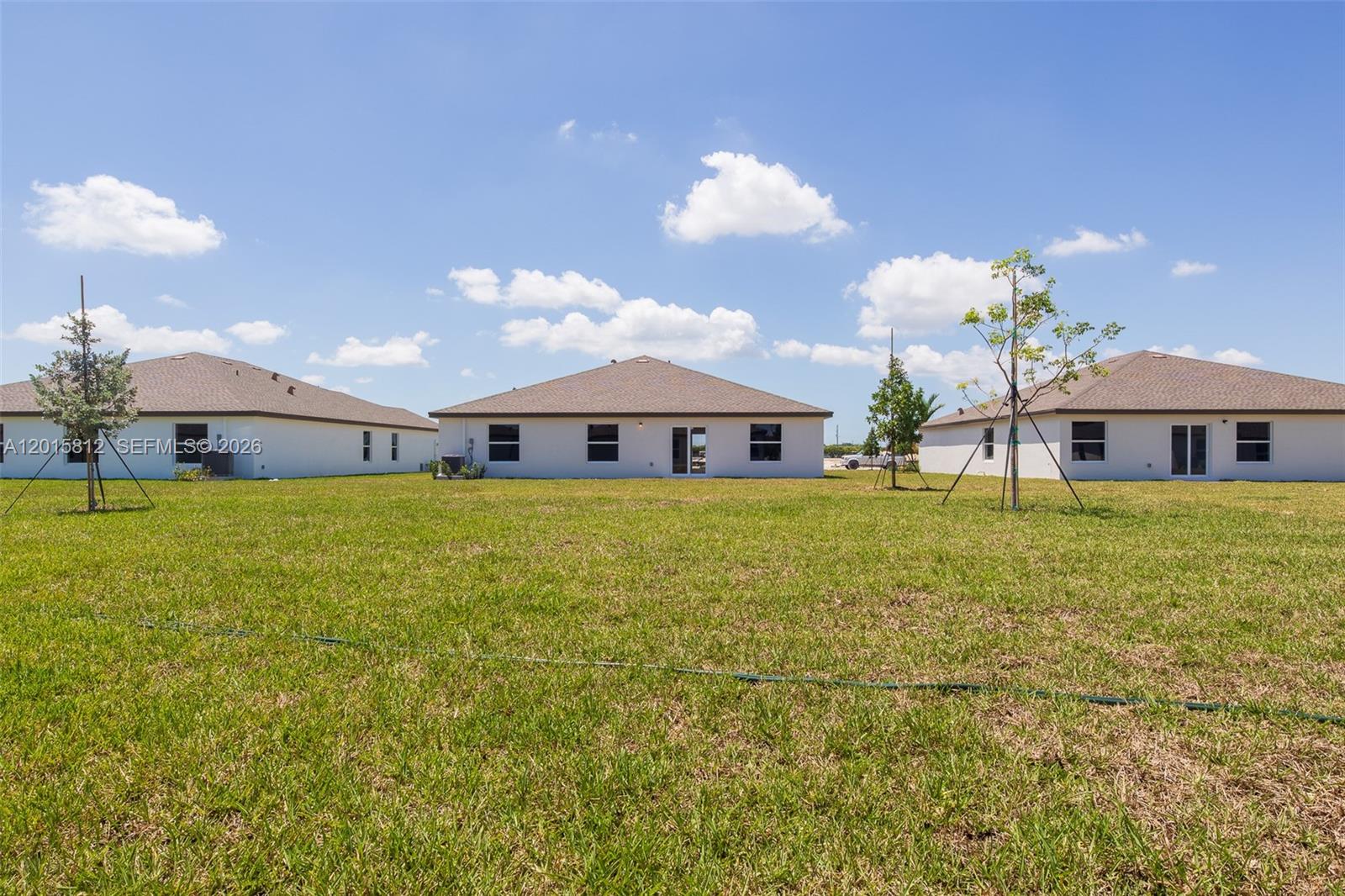 17564 Southwest 285th Street Homestead, FL 33030 - Photo 31 of 42 a front view of house with yard barbeque oven and outdoor seating