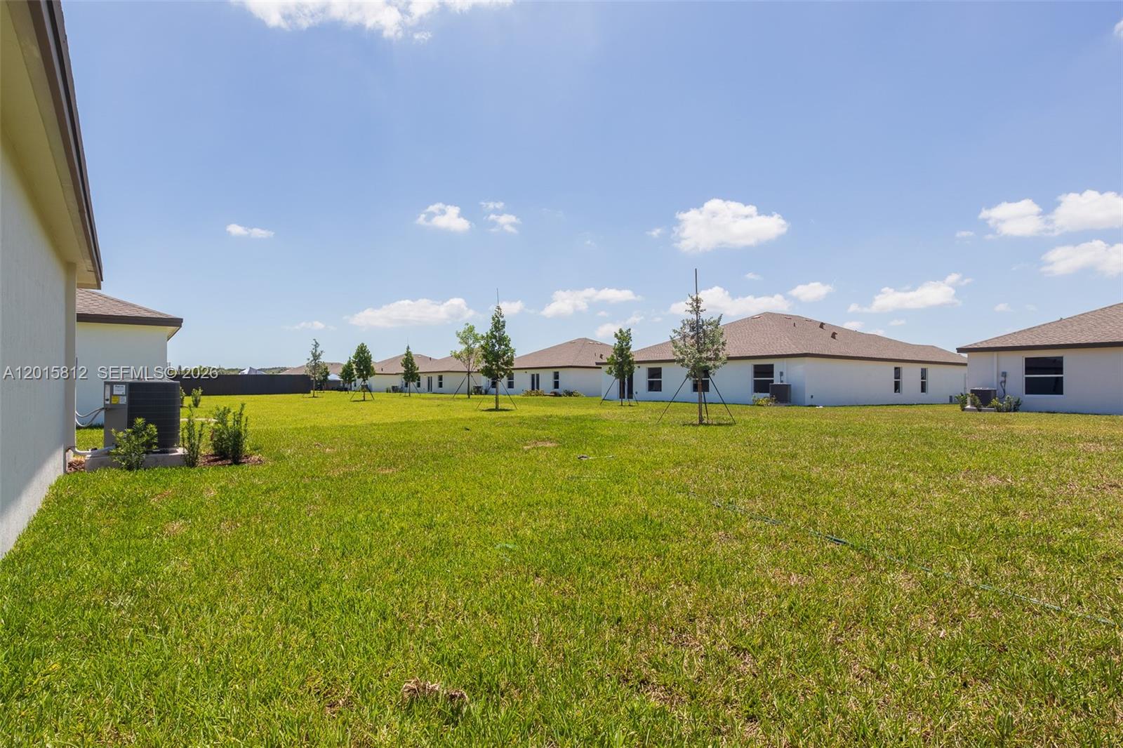 17564 Southwest 285th Street Homestead, FL 33030 - Photo 32 of 42 a swimming pool is middle in the middle of a field