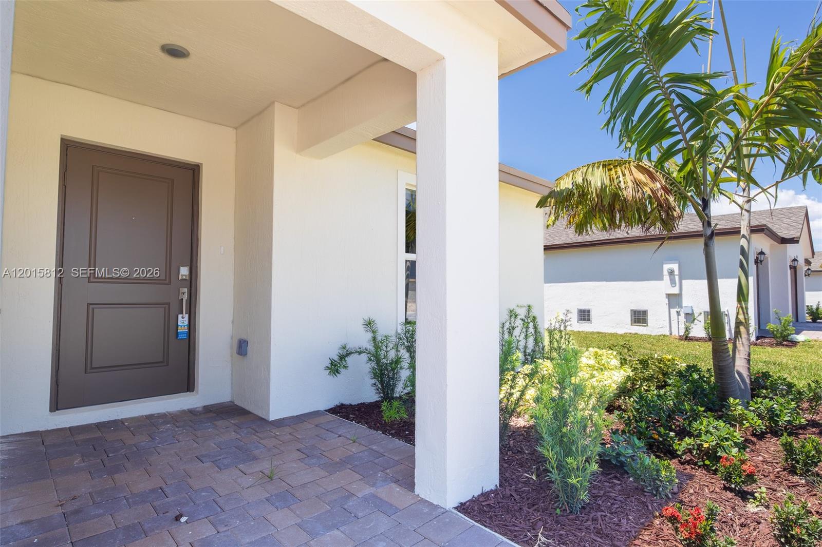 17564 Southwest 285th Street Homestead, FL 33030 - Photo 33 of 42 front view of a house with a potted plant
