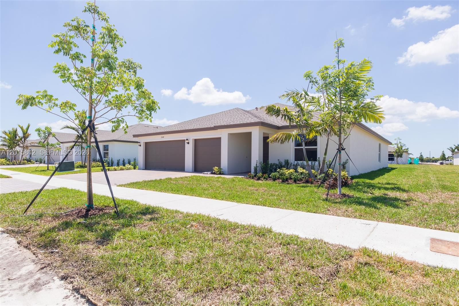 17564 Southwest 285th Street Homestead, FL 33030 - Photo 37 of 42 a house view with a garden space
