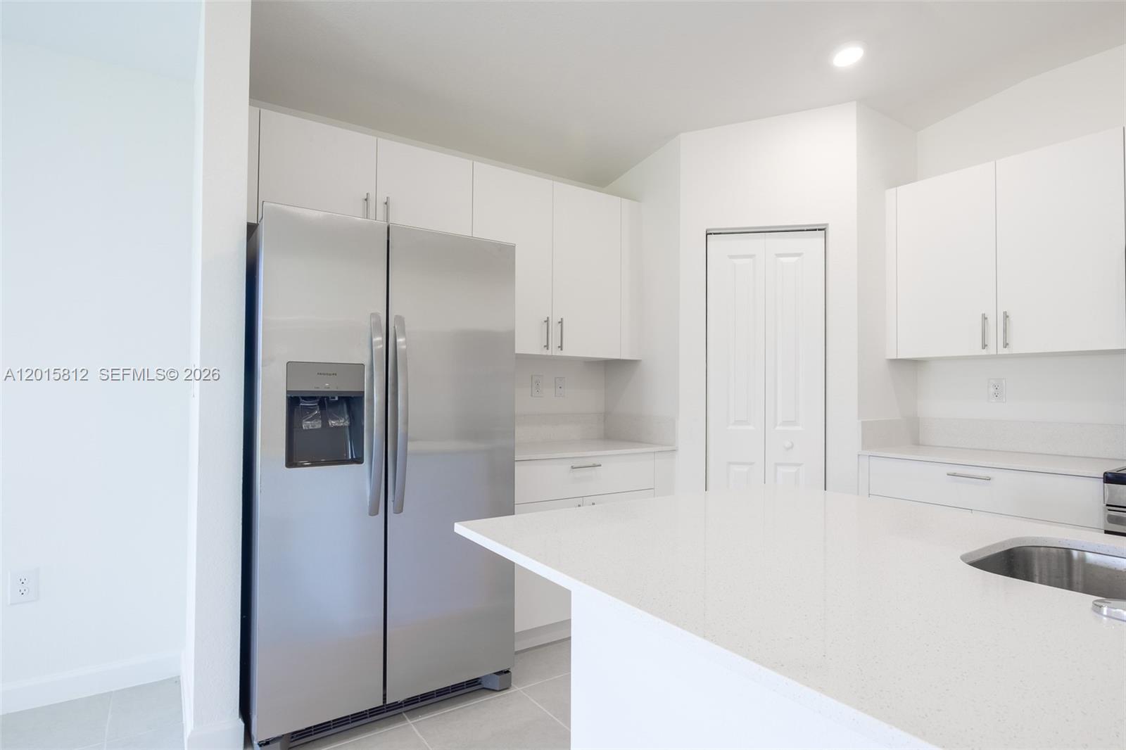 17564 Southwest 285th Street Homestead, FL 33030 - Photo 8 of 42 a kitchen with a refrigerator and sink