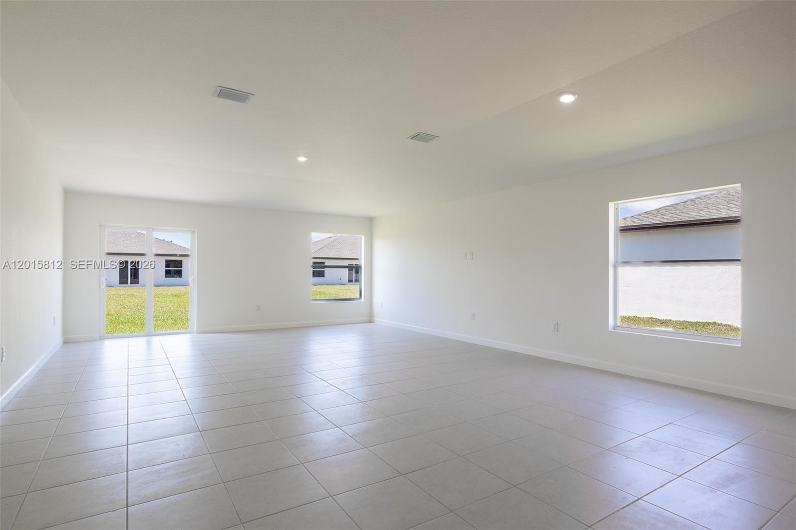 17564 Southwest 285th Street Homestead, FL 33030 - Photo 10 of 42 an empty room with windows and cabinet