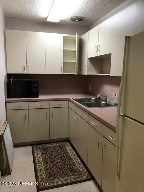 109 New Berlin Road Jacksonville, FL 32218 - Photo 8 of 8 a kitchen with a sink and cabinets