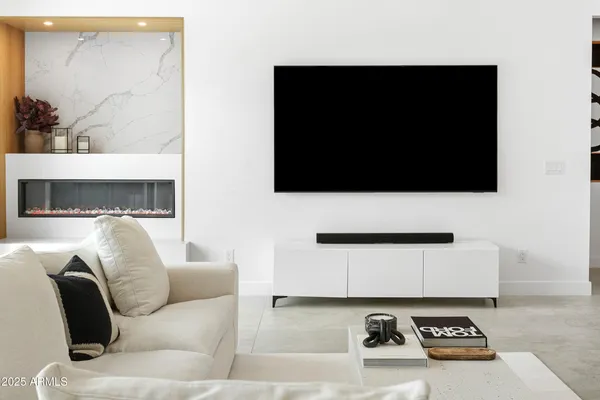 a living room with furniture white walls and white walls