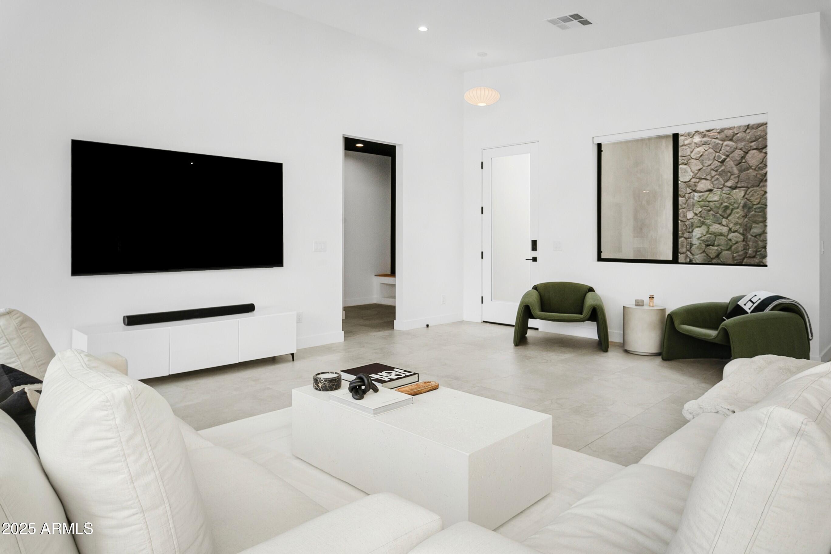 4002 North 33rd Place Phoenix, AZ 85018 - Photo 16 of 80 a living room with furniture and a flat screen tv