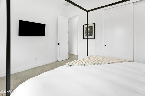 an aerial view of a house with a mountain