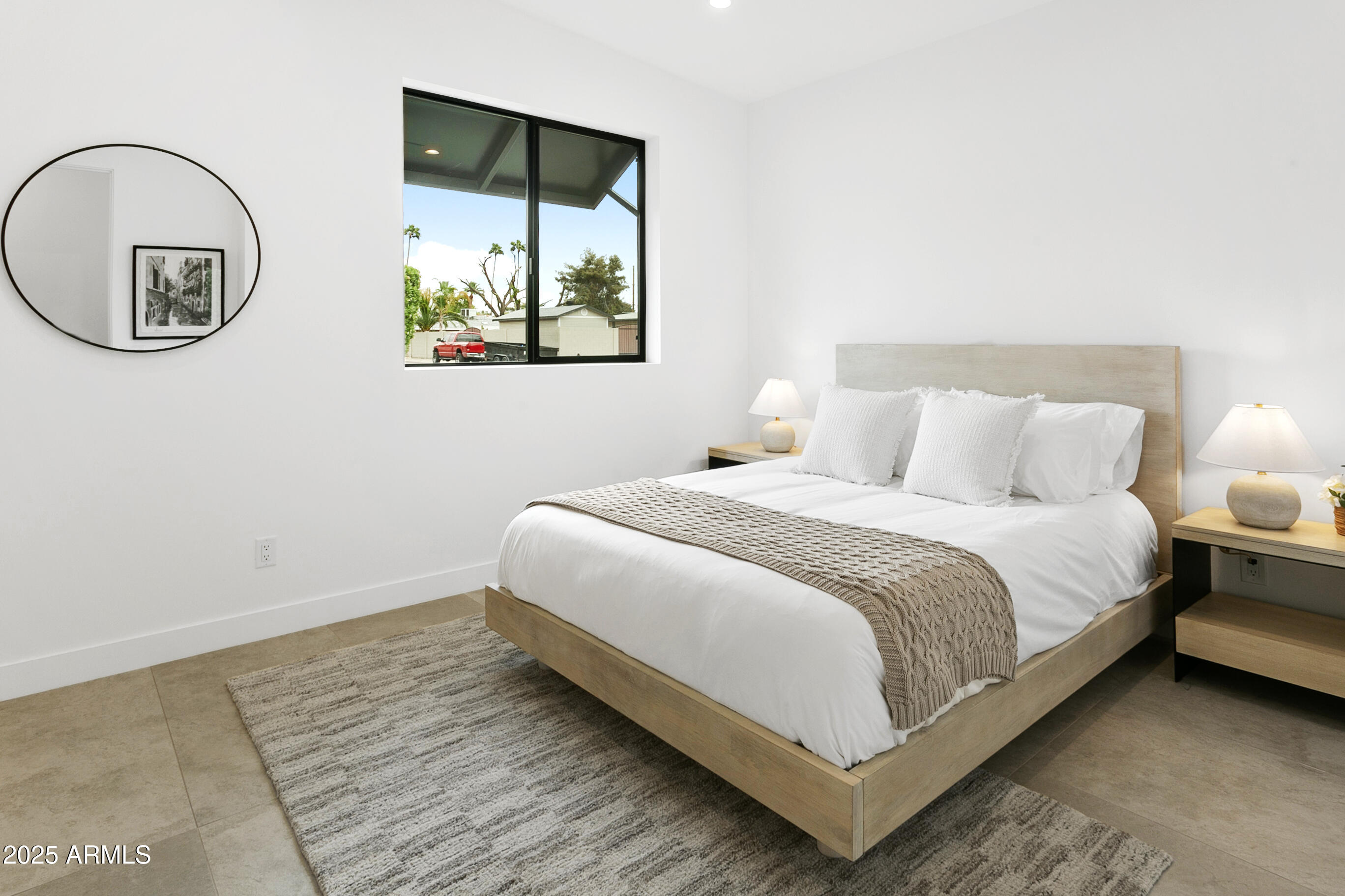 4002 North 33rd Place Phoenix, AZ 85018 - Photo 43 of 80 a bedroom with a bed and a large mirror