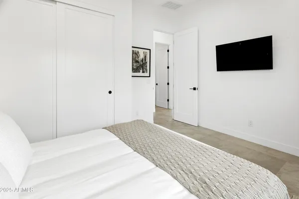 an aerial view of residential houses with outdoor space and parking