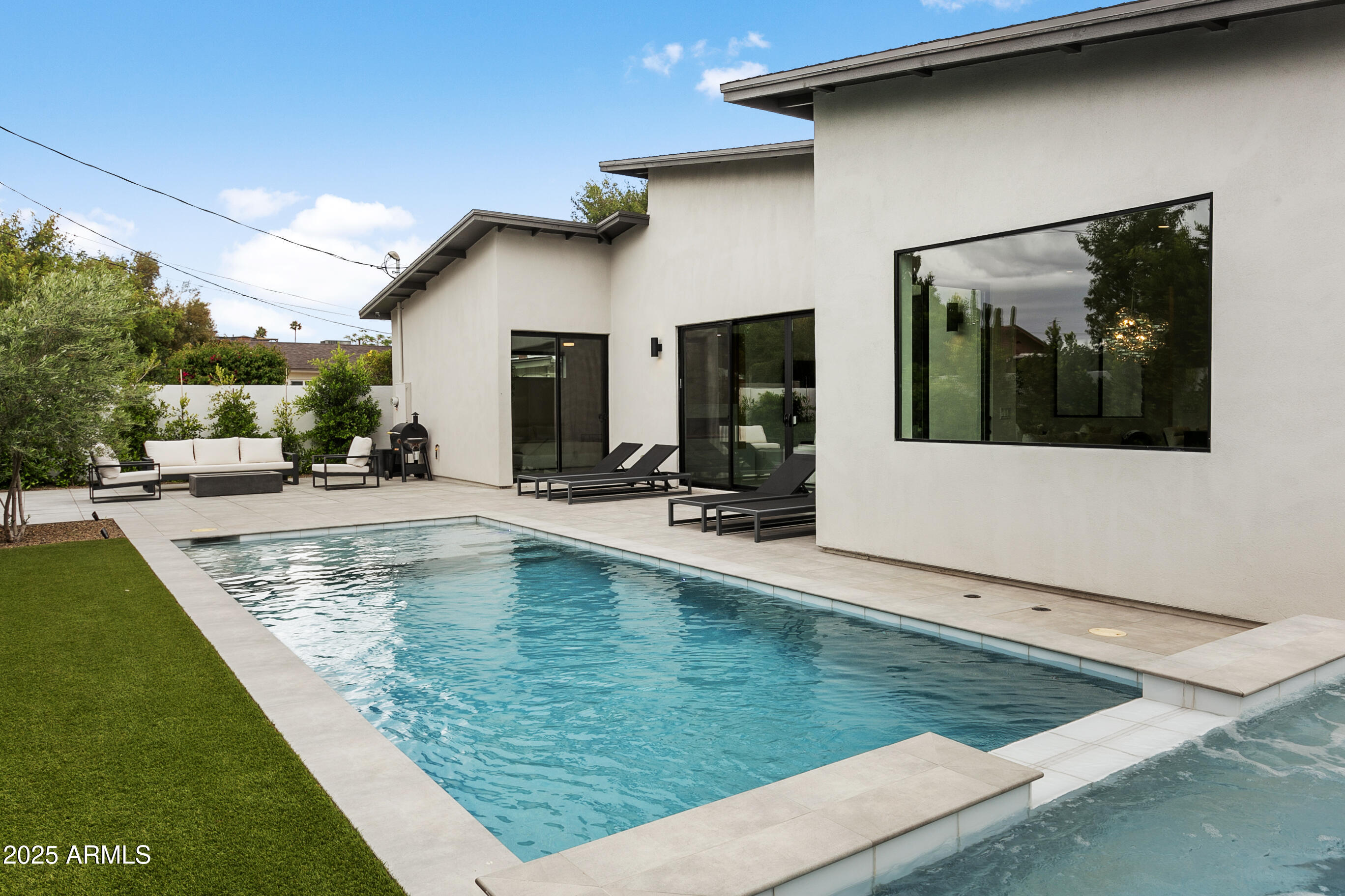 4002 North 33rd Place Phoenix, AZ 85018 - Photo 57 of 80 a view of a house with backyard swimming pool and sitting area