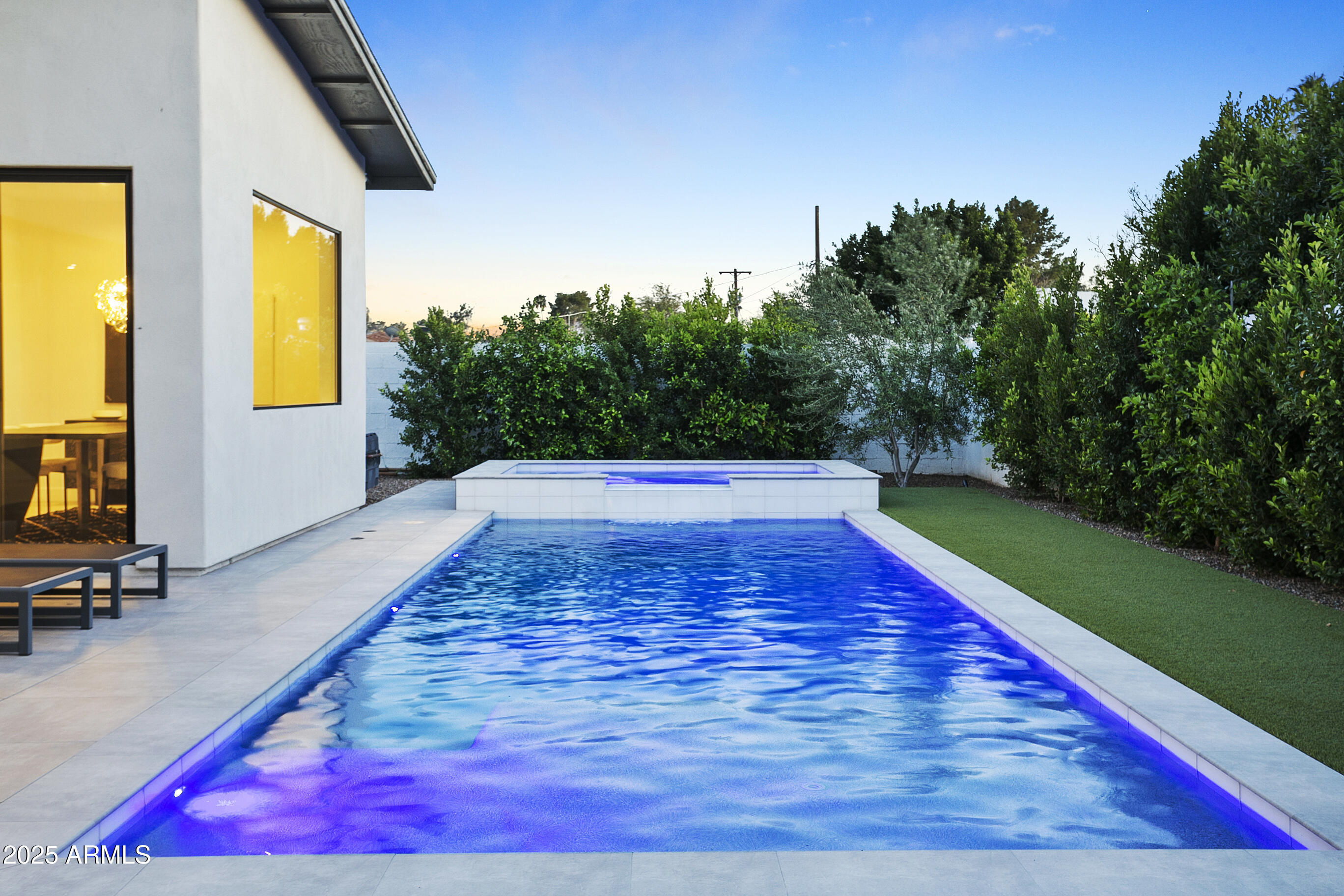 4002 North 33rd Place Phoenix, AZ 85018 - Photo 63 of 80 a view of swimming pool with seating space and trees in the background