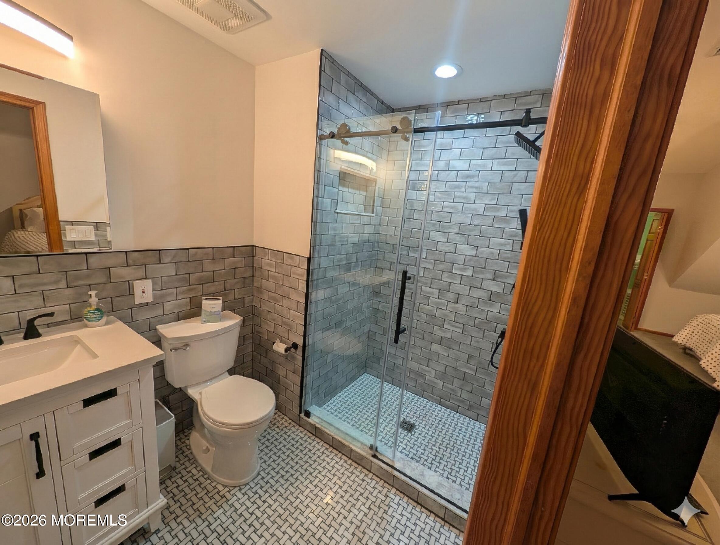 2400 Oceanfront Lavallette, NJ 08735 - Photo 23 of 29 a bathroom with a shower toilet and sink