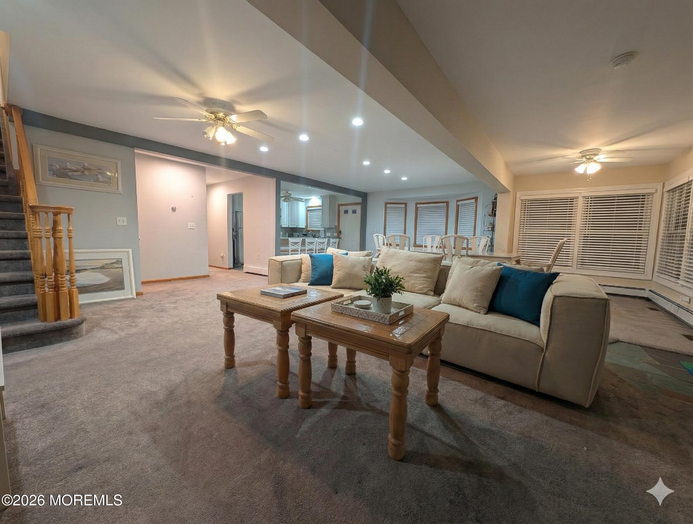 2400 Oceanfront Lavallette, NJ 08735 - Photo 24 of 29 a living room with furniture a large window and a chandelier