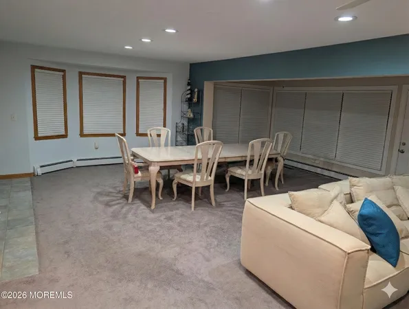 a living room with furniture a window and a table