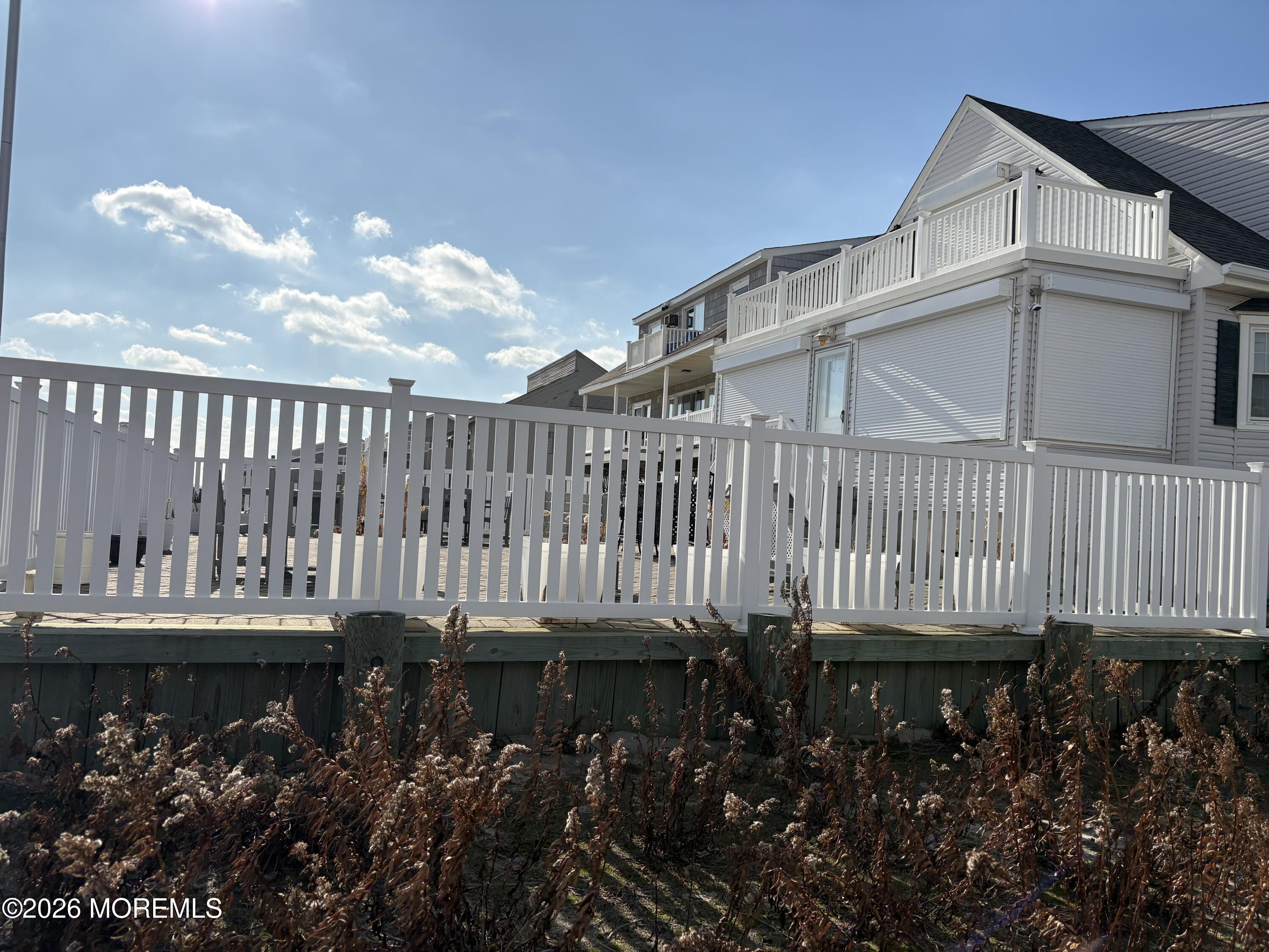 2400 Oceanfront Lavallette, NJ 08735 - Photo 5 of 29 a front view of a house with a yard
