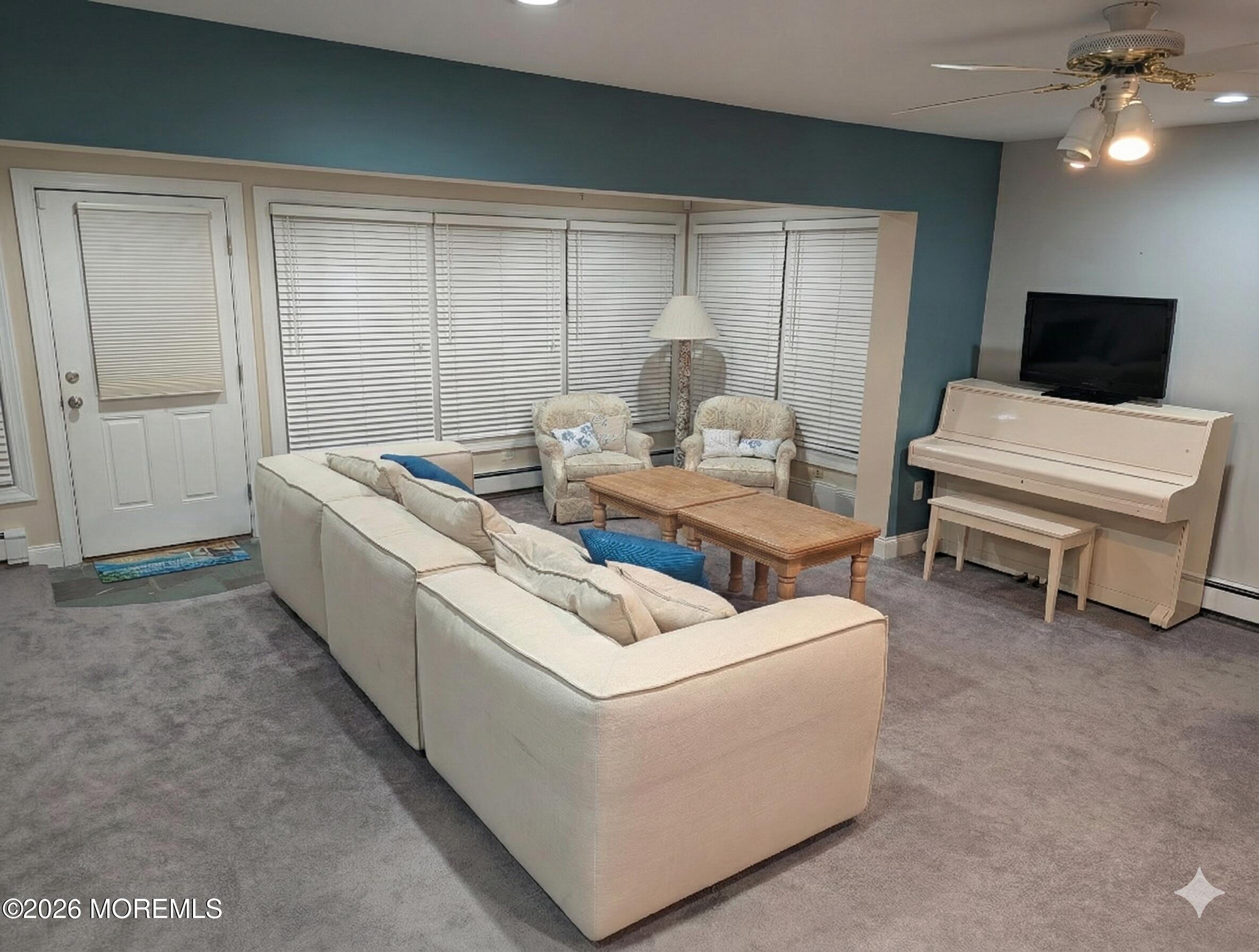 2400 Oceanfront Lavallette, NJ 08735 - Photo 6 of 29 a living room with furniture and a flat screen tv