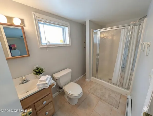 a white toilet sitting next to a bathroom sink