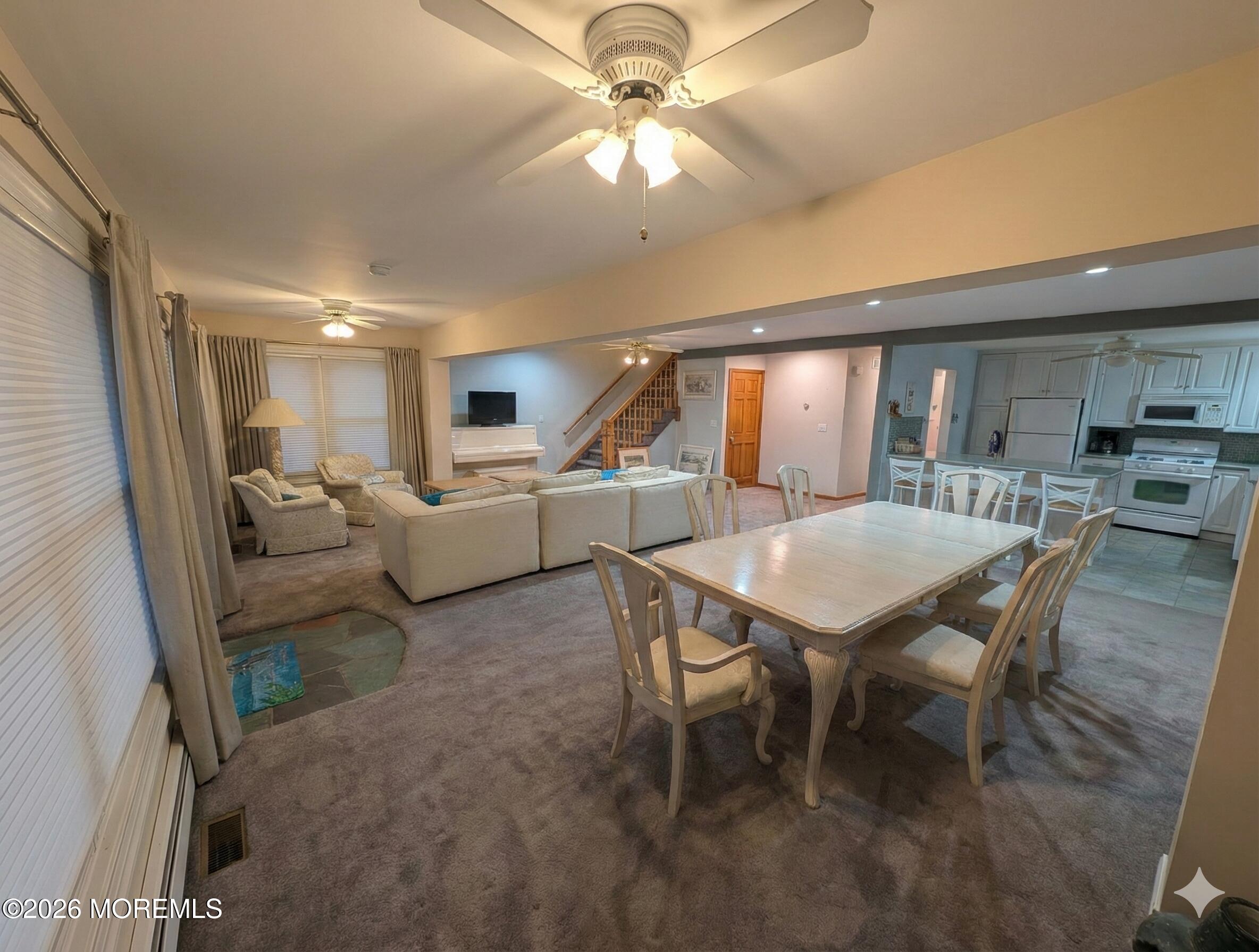 2400 Oceanfront Lavallette, NJ 08735 - Photo 9 of 29 a living room with furniture and a chandelier
