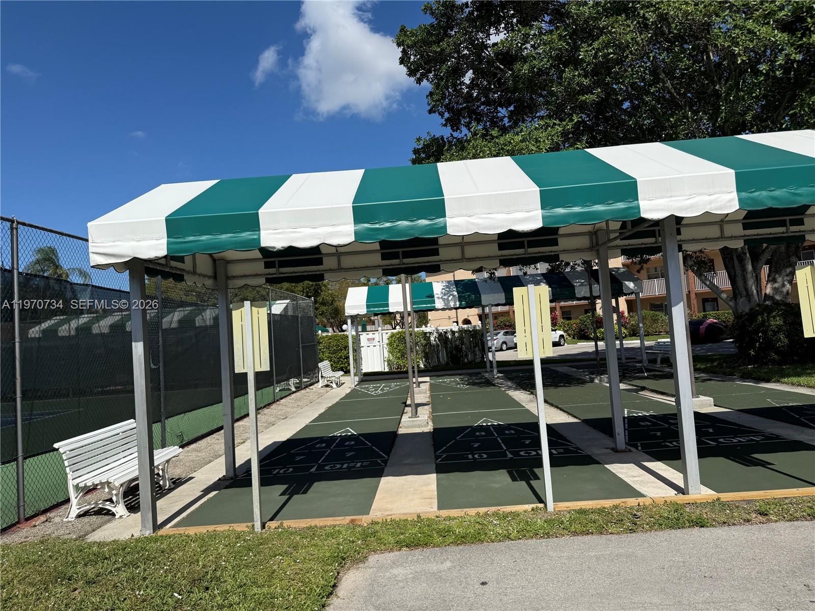 2721 North Pine Island Road, Unit 202 Sunrise, FL 33322 - Photo 11 of 12 a front view of a building with street