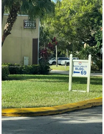 a view of a park with welcome board