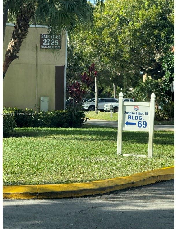 2721 North Pine Island Road, Unit 202 Sunrise, FL 33322 - Photo 2 of 12 a view of a park with welcome board