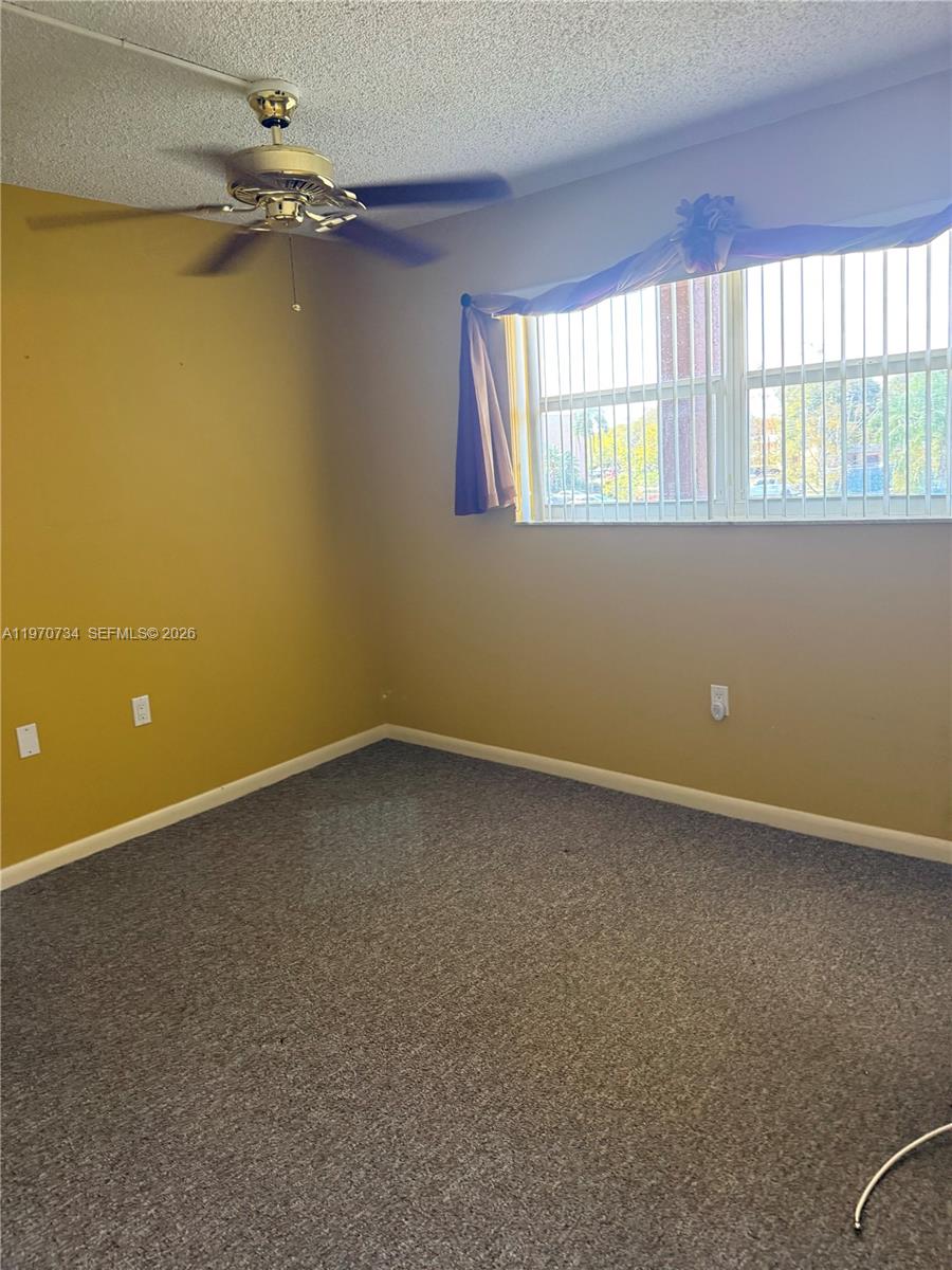 2721 North Pine Island Road, Unit 202 Sunrise, FL 33322 - Photo 5 of 12 an empty room with a window
