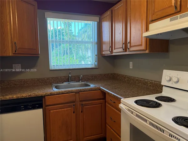 a kitchen with a stove and a sink
