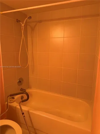 a bathroom with a shower and a shower