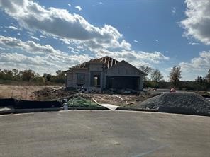 a view of a house with a yard and pathway