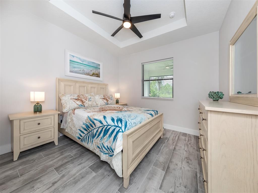 17566 De Miranda Avenue North Port, FL 34287 - Photo 19 of 94 a bedroom with a bed and a window