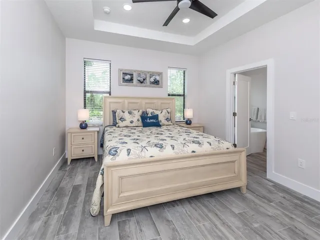 a white bath tub sitting in a bathroom next to a window