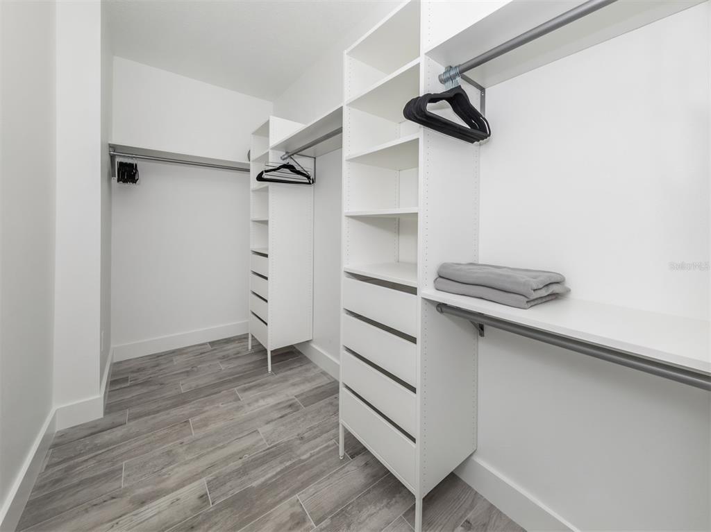 17566 De Miranda Avenue North Port, FL 34287 - Photo 22 of 94 a view of walk in closet with empty racks