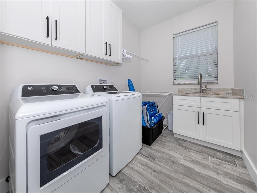17566 De Miranda Avenue North Port, FL 34287 - Photo 25 of 94 a utility room with dryer and washer