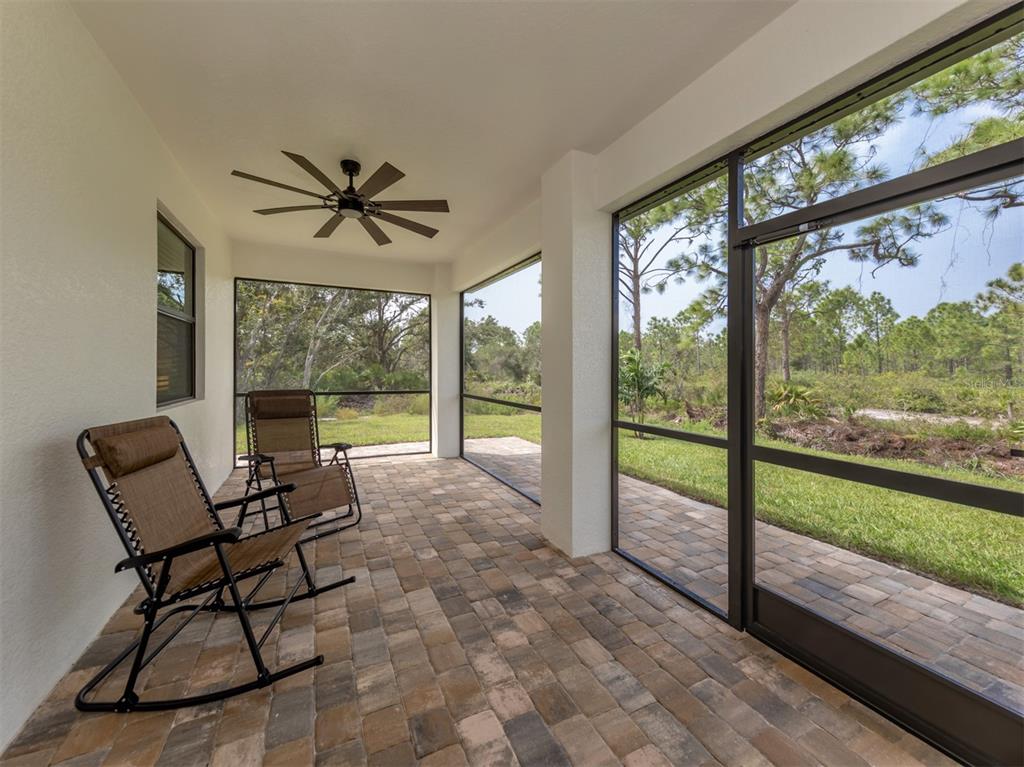 17566 De Miranda Avenue North Port, FL 34287 - Photo 27 of 94 a living room with a large window