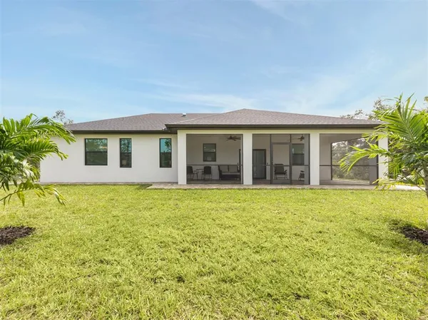 a aerial view of a house with a yard