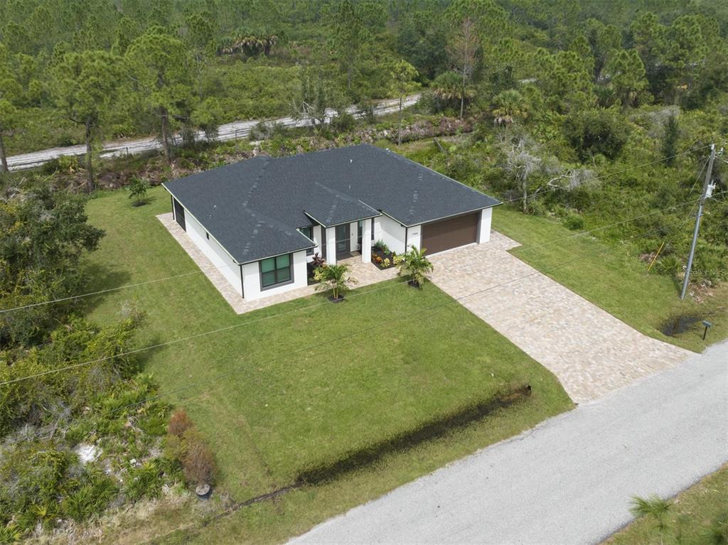 17566 De Miranda Avenue North Port, FL 34287 - Photo 31 of 94 a aerial view of a house next to a big yard