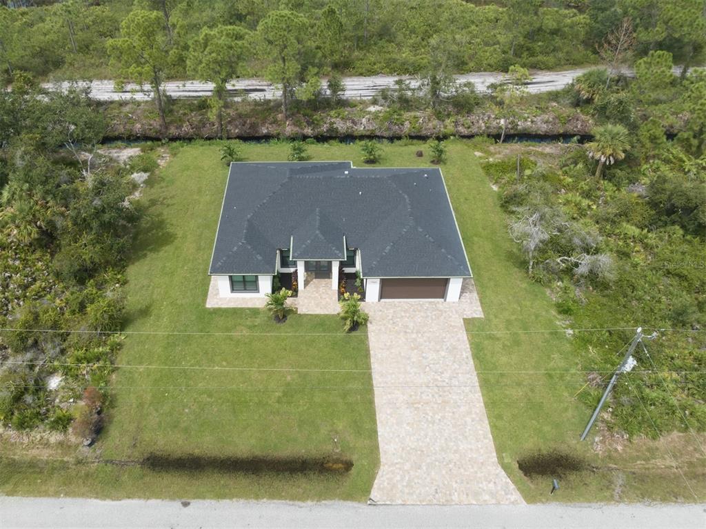 17566 De Miranda Avenue North Port, FL 34287 - Photo 32 of 94 an aerial view of a house with a yard