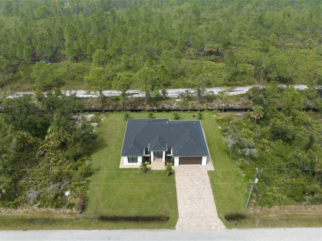 17566 De Miranda Avenue North Port, FL 34287 - Photo 33 of 94 an aerial view of a house with a yard