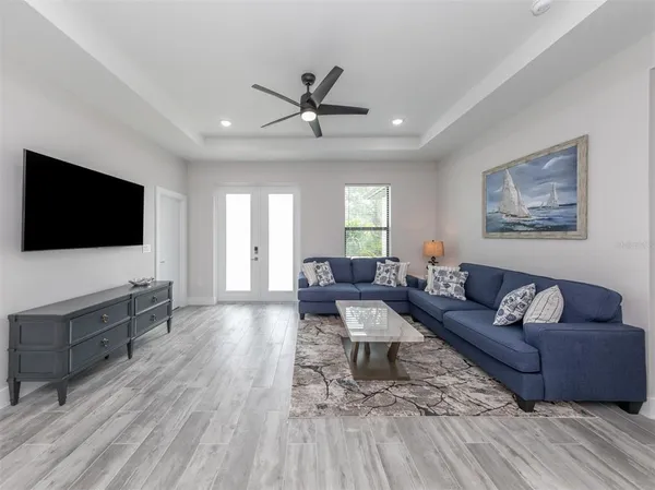 a living room with furniture and a flat screen tv