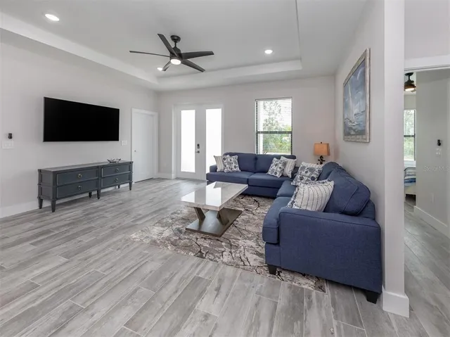 a living room with furniture and a flat screen tv