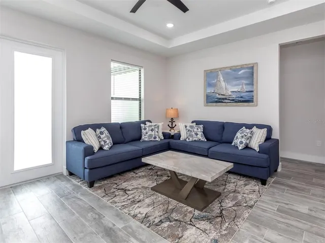 a living room with furniture and a window