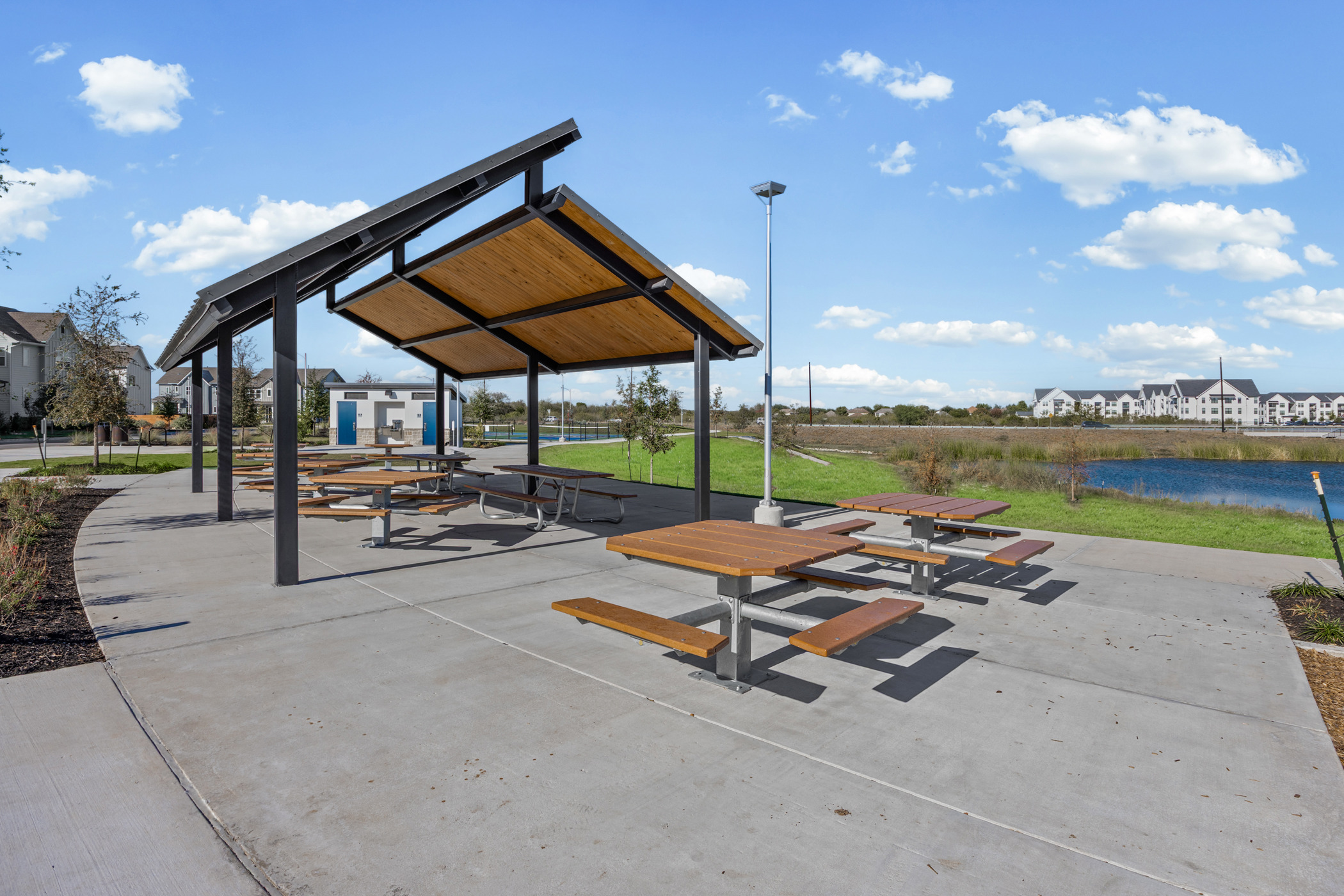 5806 Rangeland Road Austin, TX 78747 - Photo 33 of 34 Enjoy outdoor gatherings under the shelter of this covered picnic area with lake views.