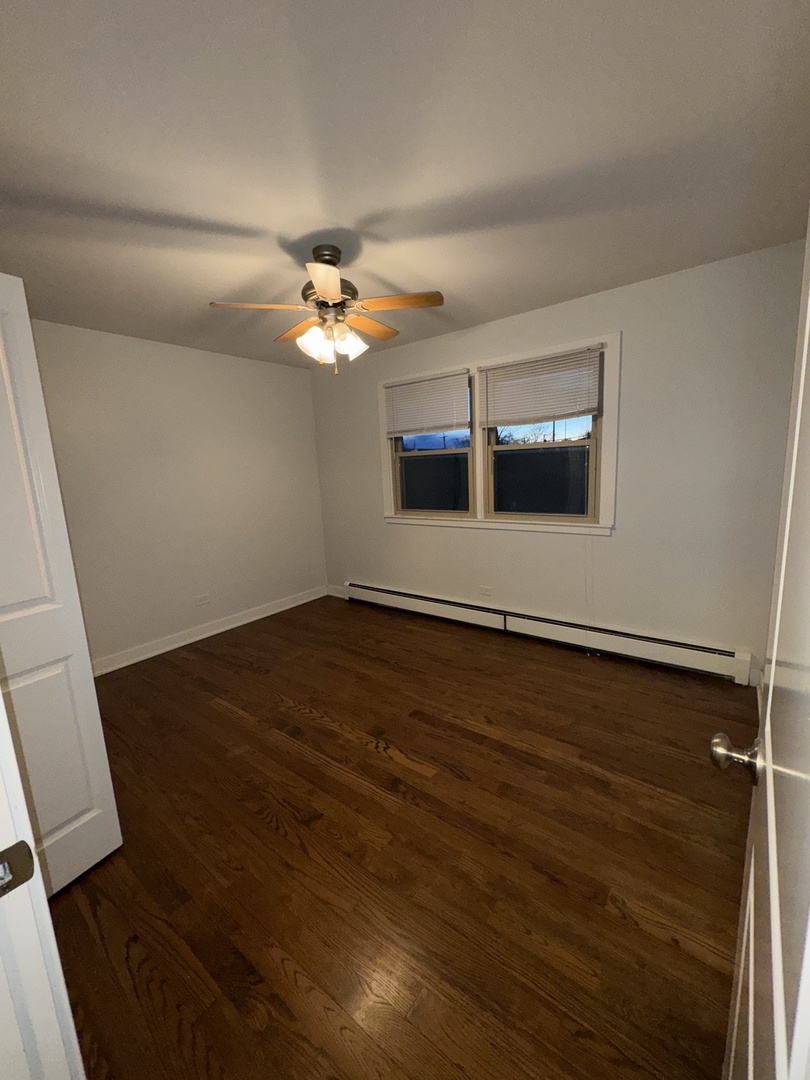 4612 Forest Avenue, Unit 8 Brookfield, IL 60513 - Photo 4 of 10 wooden floor in an empty room with a window