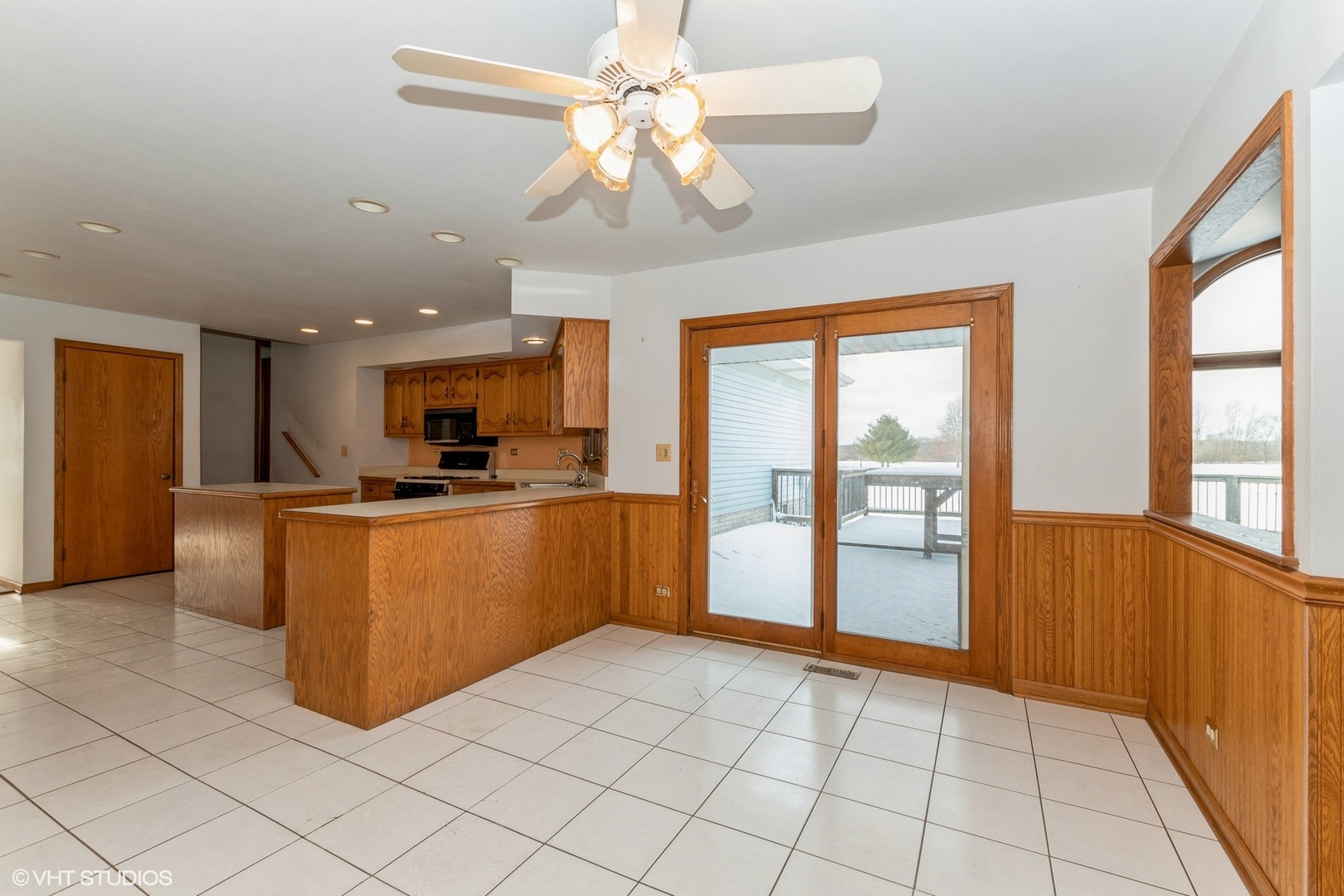 29460 South Wallingford Road Manhattan, IL 60442 - Photo 9 of 22 a view of kitchen with stainless steel appliances granite countertop a refrigerator a sink dishwasher with a dining table and chairs with wooden floor