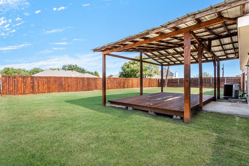 712 Billups Street Van Alstyne, TX 75495 - Photo 36 of 38 a view of yard with patio